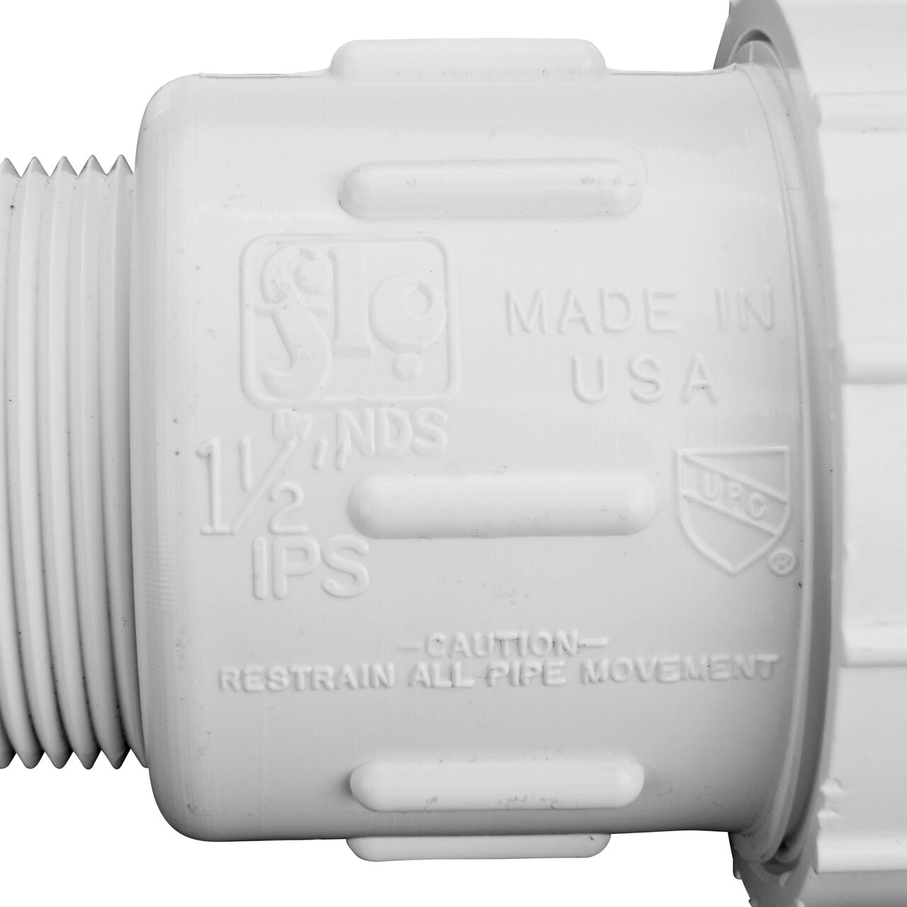 Closeup view of the NDS PVC Compression Adapter, 1-1/2 in. IPS UC X 1-1/2 in. IPS MPT showing that it is made in the USA as part of a complete flow management system for pool, spa, irrigation, and plumbing applications (NDS CPA-1500)