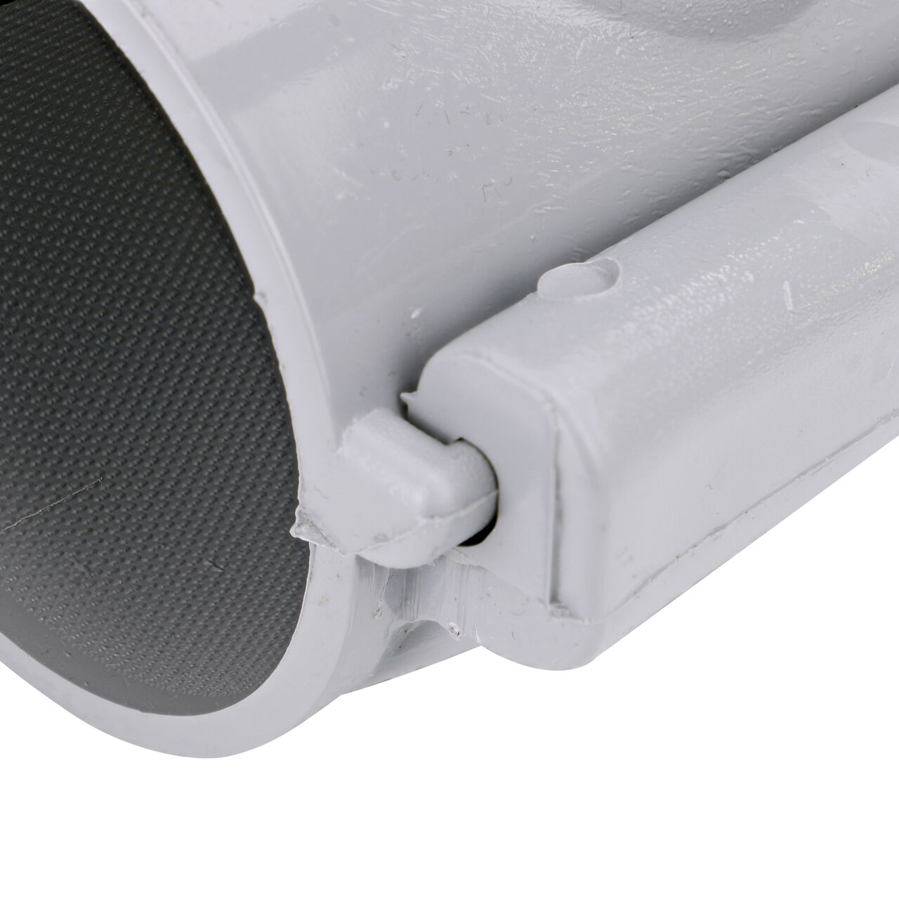 Closeup view of the hinge on the 3 in. NDS Flo-Tap™ Rigid PVC saddle with 1-1/2 in. socket or 2 in. spigot in the closed position  (NDS 3230)