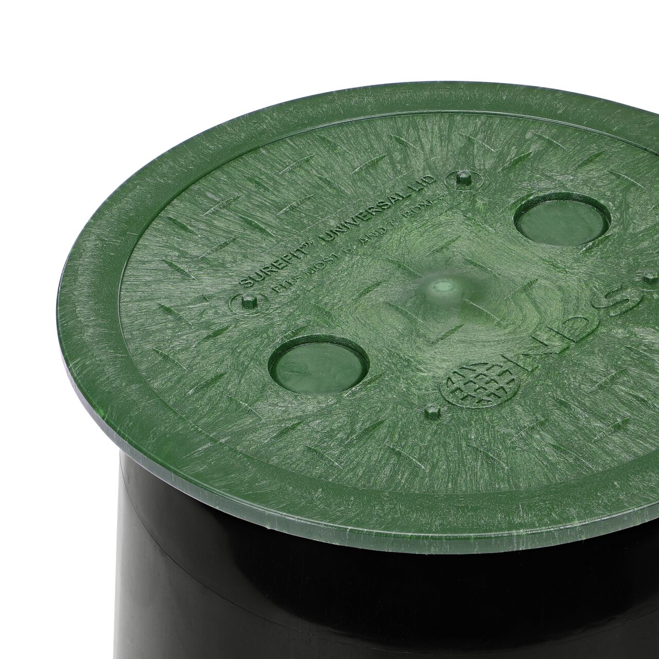 Closeup of the 6 in. Round SureFit Universal Valve Box Lid (NDS 6RND-UC) installed on a black 6 in. Ewing valve box