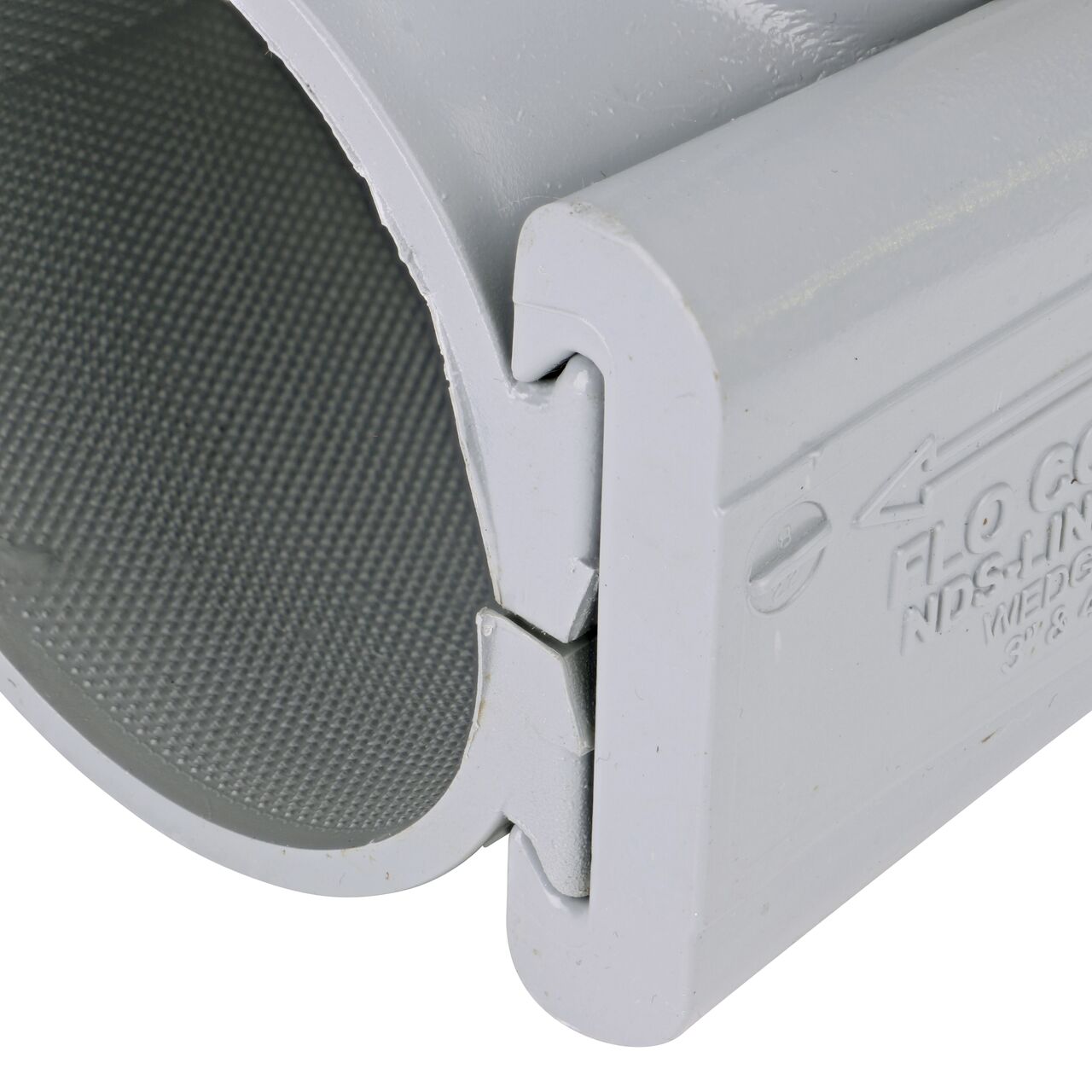 Closeup view of the wedge securely in the closed position on the 3 in. NDS Flo-Tap™ Rigid PVC saddle with 3/4 in. socket or 1 in. spigot (NDS 3130)