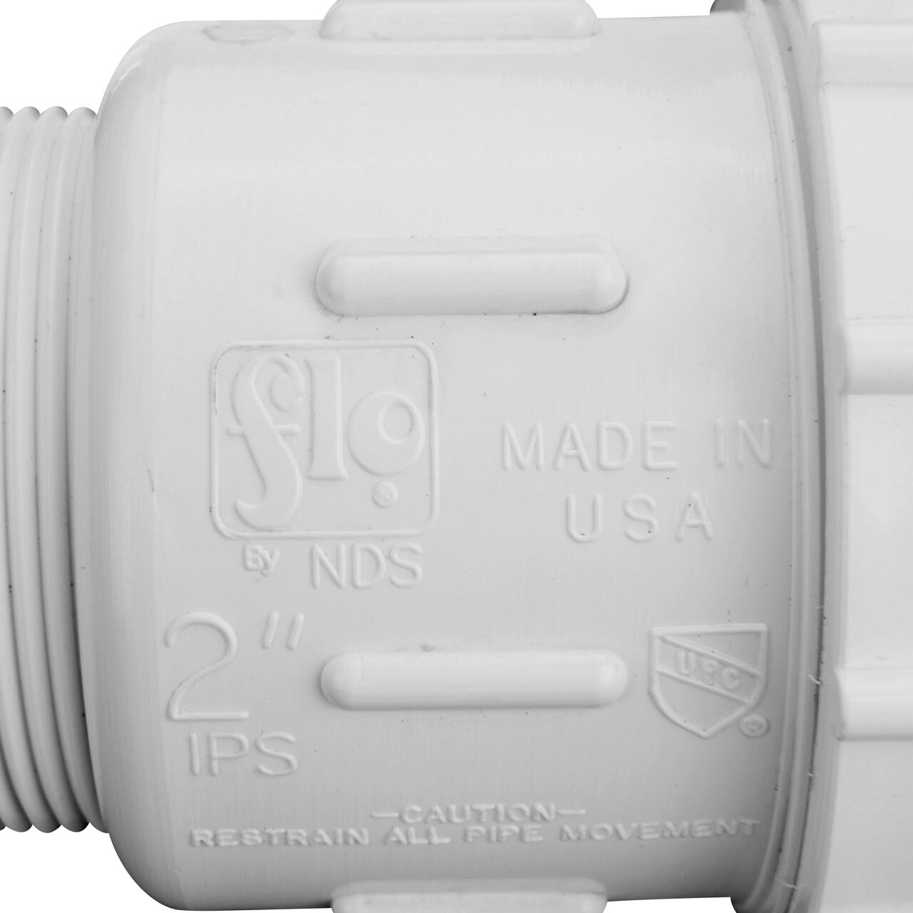 Closeup view of the NDS PVC Compression Adapter, 2 in. IPS UC X 2 in. IPS MPT showing that it is made in the USA as part of a complete flow management system for pool, spa, irrigation, and plumbing applications (NDS CPA-2000)