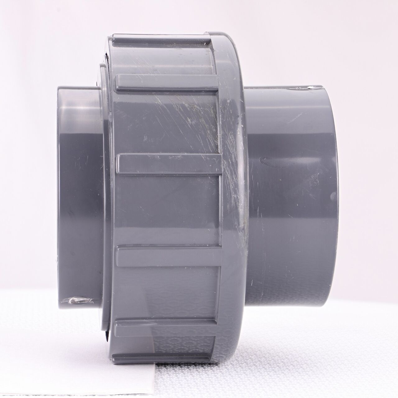 Side view of the NDS 2-1/2 in. PVC Union (NDS U-2500-S) shows both slip ends and a pull-apart feature to quickly disconnect from pipes