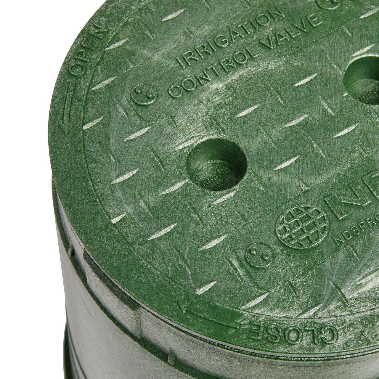 The valve box lid securely in place on the NDS 6 in. Round Standard Series Green Box and Green Irrigation Control Valve Cover (NDS 2108BC) keeping components protected against the elements, foot traffic, lawn care equipment, and potential vandalism while keeping them out of sight