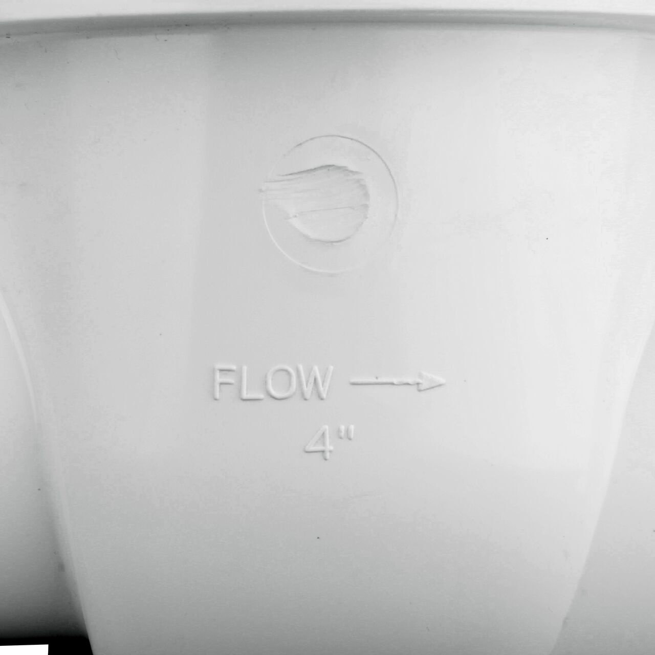 Closeup of the outside part of the NDS White PVC 4 in. Backwater Valve with stamped arrow showing the direction in which the water will flow (NDS 475P)
