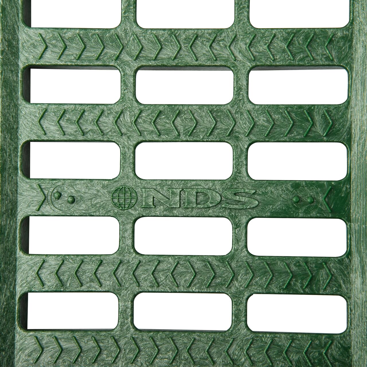 Top down partial closeup of grate openings on NDS 5 in. Pro Series Channel Drain Grate in Green Plastic (NDS 815)