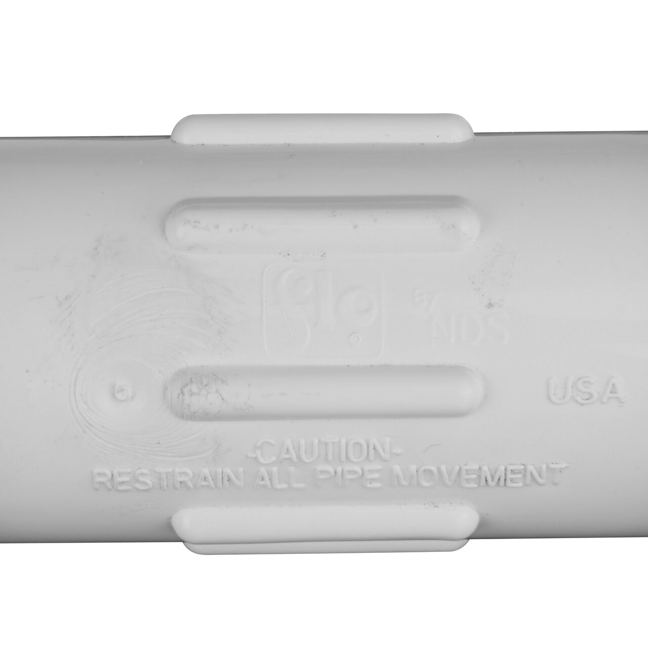 Closeup view of the NDS 3/4 in. IPS UC Compression Coupling showing that it is made in the USA as part of a complete flow management system for pool, spa, irrigation, and plumbing applications (NDS CCC-0500)