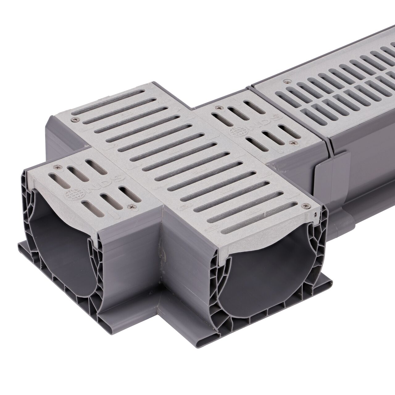 Connect the smaller grate design end on the Spee-D® Channel Drain and Grate with Cross (NDS 2361) to the Spee-D® Channel Drain (NDS 400-10, NDS 400-10RTL, NDS 241-1*) with the Spee-D® Channel Drain Coupling (NDS 248)