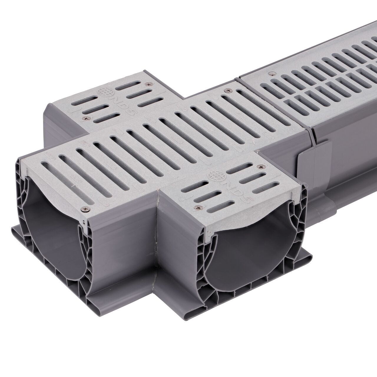 Connect the longer grate design on the Spee-D® Channel Drain and Grate with Cross (NDS 2361) to the Spee-D® Channel Drain (NDS 400-10, NDS 400-10RTL, NDS 241-1*) with the Spee-D® Channel Drain Coupling (NDS 248)