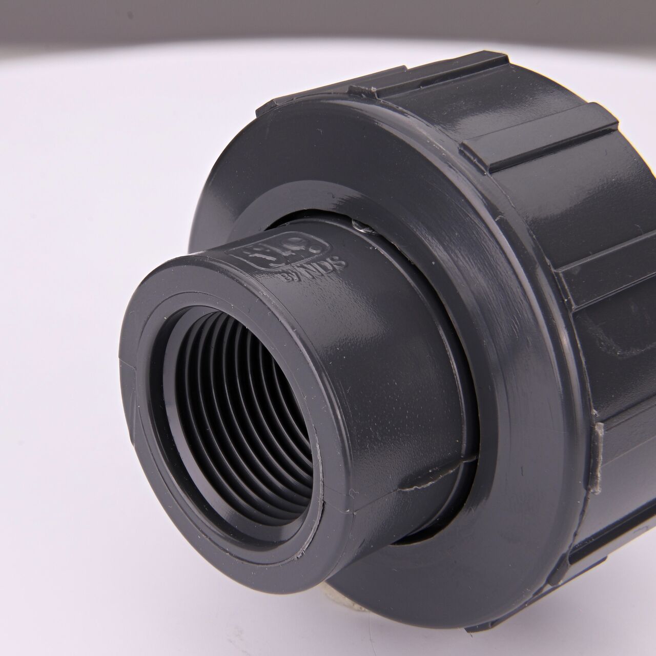 Closeup view of the other threaded end on the NDS 3/4 in. PVC Union (NDS U-0750-T) used to connect pipes and provide a quick way to separate pipes when needed
