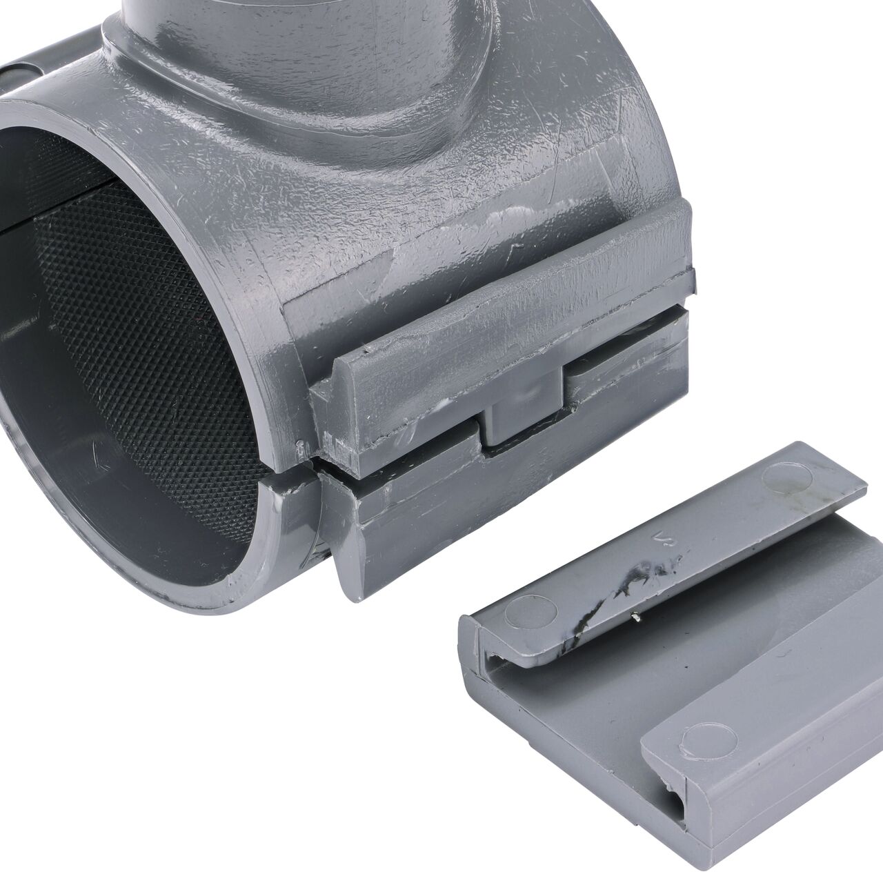 Closeup of the wedge latch uninstalled on the NDS Clamp-It™ Rigid PVC Saddle for 2 in. PE pipe with 1 in. FPT on top (NDS 322010P)