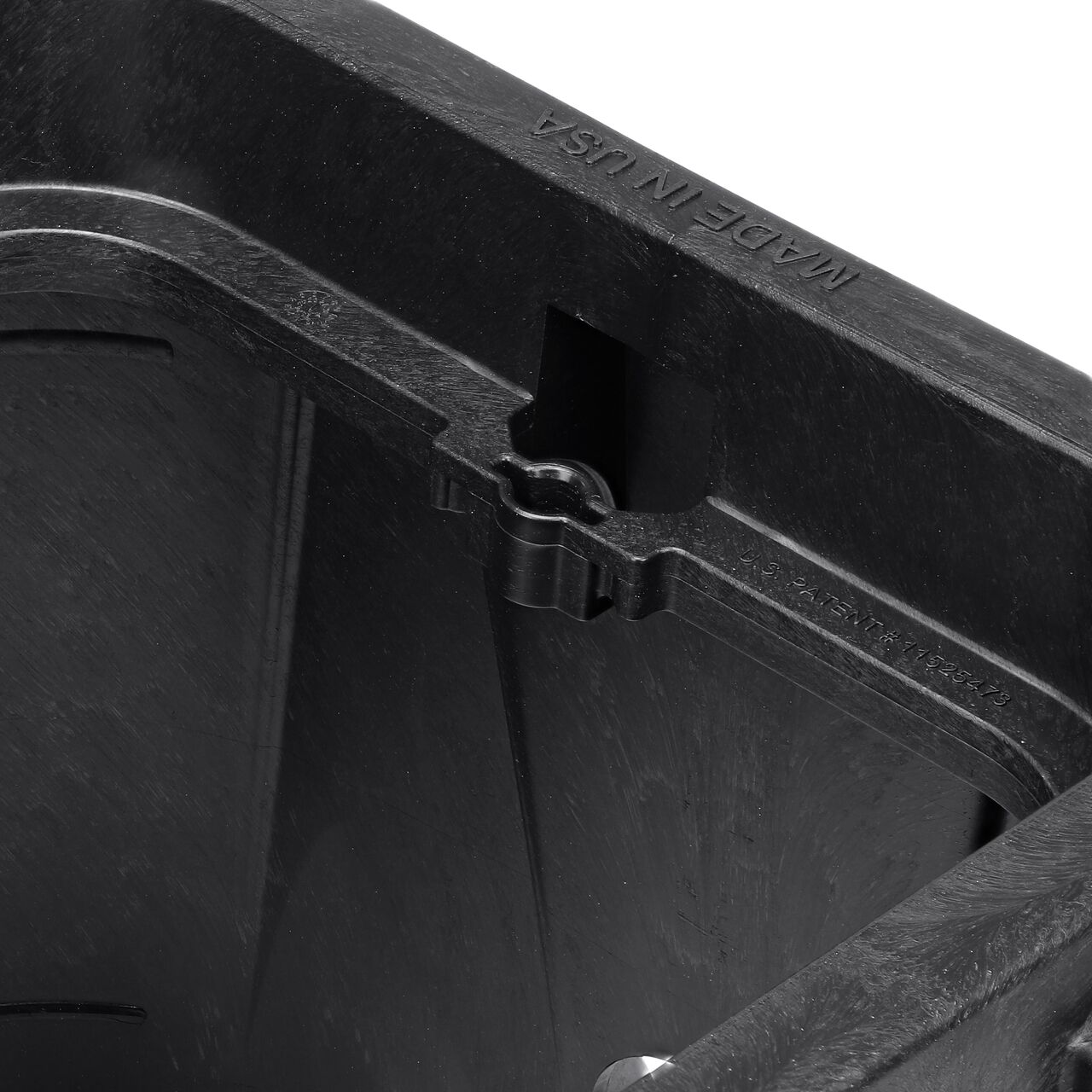 Closeup view of the universal locking mechanism hole on the Black NDS 14 in. X 19 in. Rectangular Pro-Spec® Series Valve Box (NDS 314BBLK) for securing valve lid or cover to the valve box