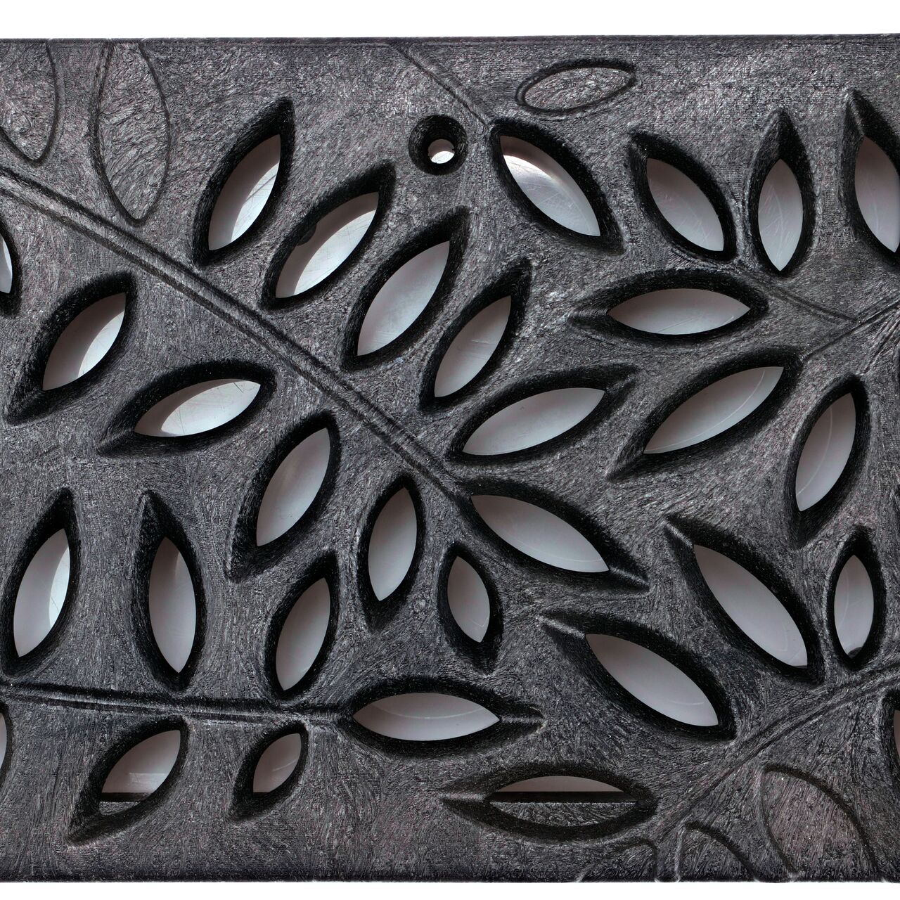 Closeup top down view of NDS Spee-D® Channel Drain Grate, Decorative Botanical Design in Black Plastic (NDS 252)