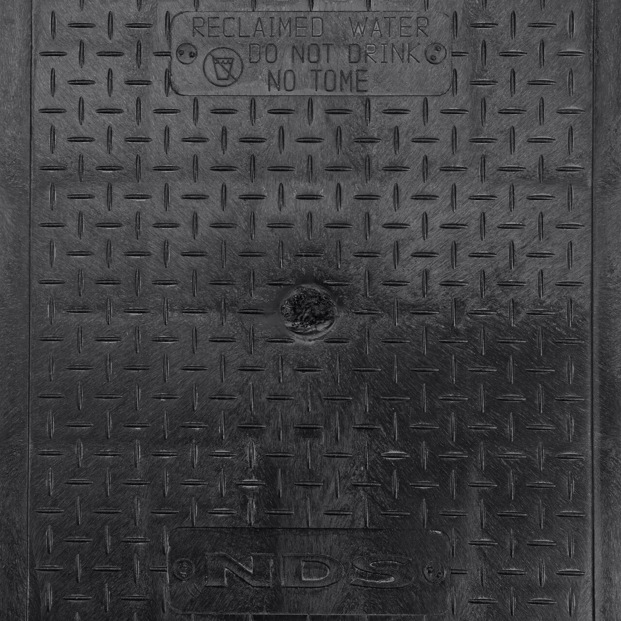 Closeup view of the Reclaimed Water markings on the Black Reclaimed Water cover for the NDS 14 in. X 19 in. Rectangular Pro-Spec® Series Valve Box (NDS 313BCBRBLK)