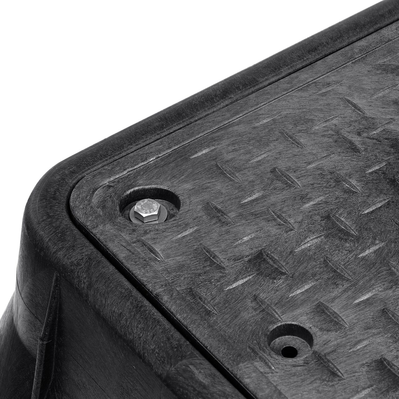 The valve box lid securely in place on the NDS 13 in. X 24 in. Rectangular Standard Series Black Box and Black Water Meter Cover with Bolt (NDS 121BCDMCIFB) keeping components protected against the elements, foot traffic, lawn care equipment, and potential vandalism while keeping them out of sight