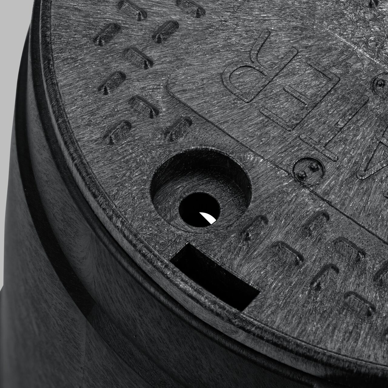 The valve box lid securely in place on the NDS 10 in. Round Standard Series Black Box and Black Water Cover (NDS 111BCW) keeping components protected against the elements, foot traffic, lawn care equipment, and potential vandalism while keeping them out of sight