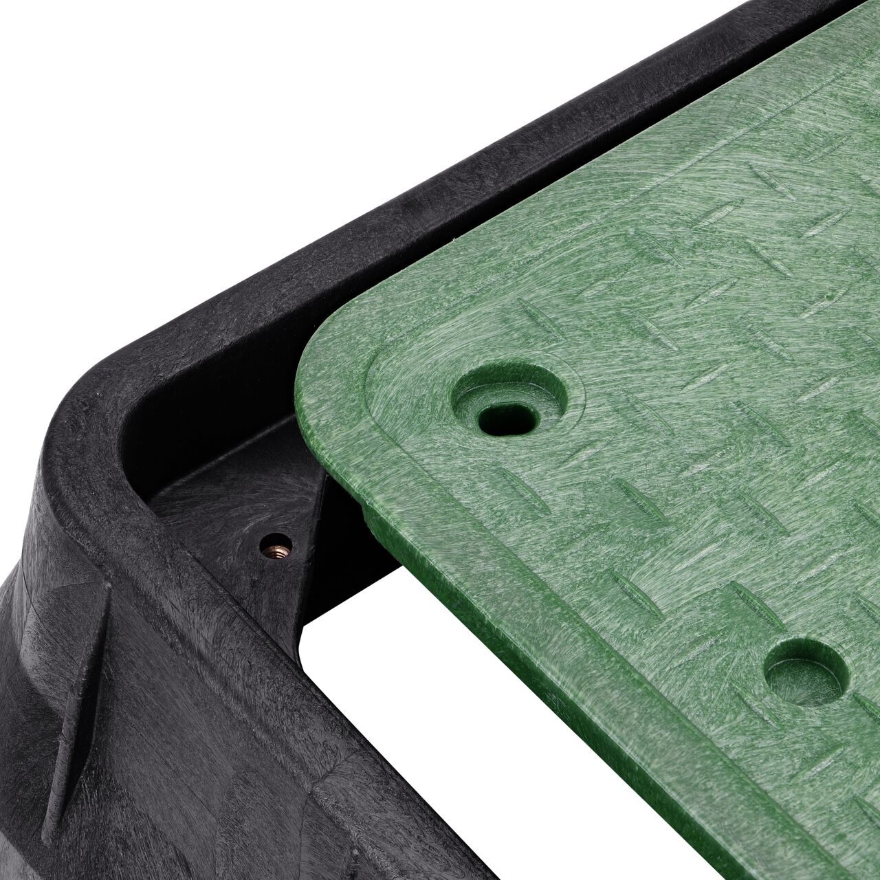The valve box lid and bolt securely in place on the NDS 13 in. X 24 in. Rectangular Pro-Spec® Series Black Box and Green Irrigation Control Valve Cover (NDS 325BCB) keeping components protected against the elements, foot traffic, lawn care equipment, and potential vandalism while keeping them out of sight