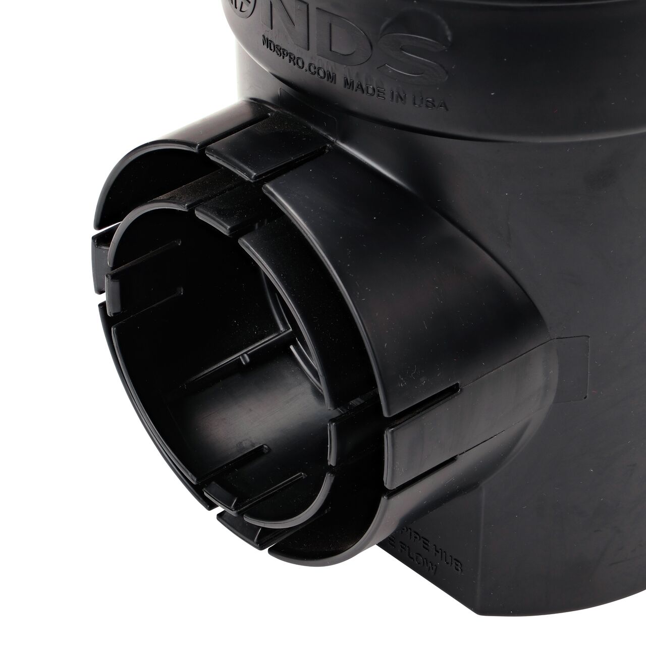 Close-up view of the locking tab outlet that connects to 3 in. or 4 in. pipe on the NDS 6 in. Round Spee-D Catch Basin Drain with Black Plastic Atrium Grate (NDS 101, NDS 101ATBLKIT)