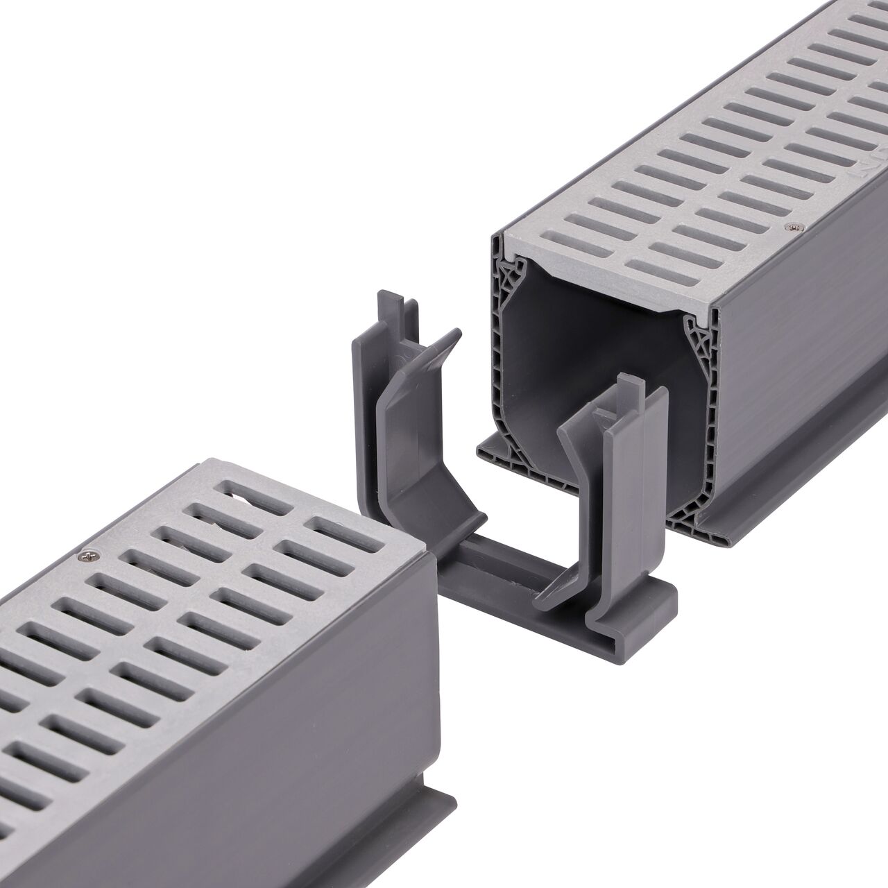 Step 1: Use the Mini Channel™ Drain Coupling (NDS 548) to connect two Mini Channel™ Drains (NDS 500) with gray grate (NDS 541) for a secure fit