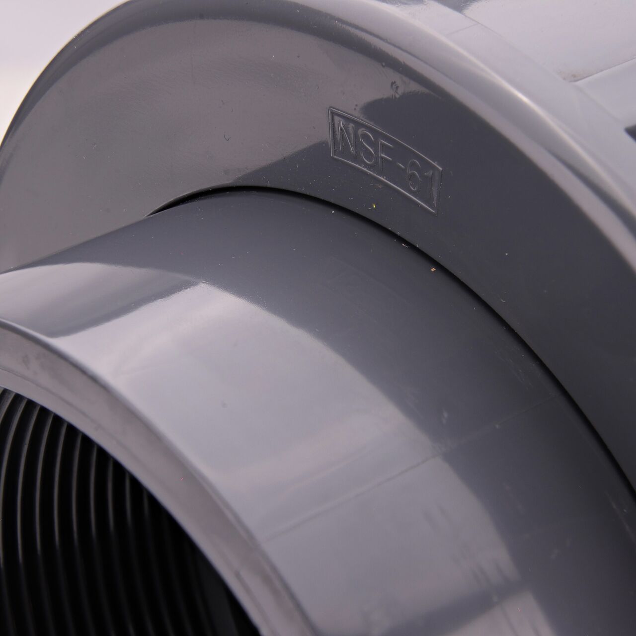 Closeup view of the NDS PVC Union shows each end is labeled that it connects to 4 in. Schedule 80 pipe for residential, commercial, and industrial applications (NDS U-4000-T)