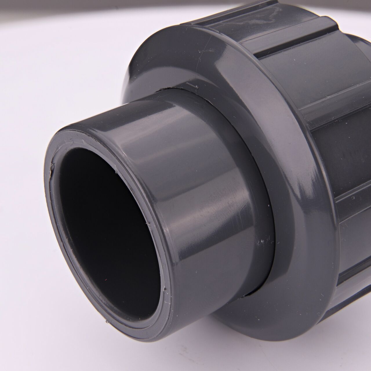 Closeup view of the other threaded end on the PVC Union, 1 in. Sch. 80 S X FPT (NDS U-1000-ST) which provides a corrosion-free connection between pipes and prevents costly property damage