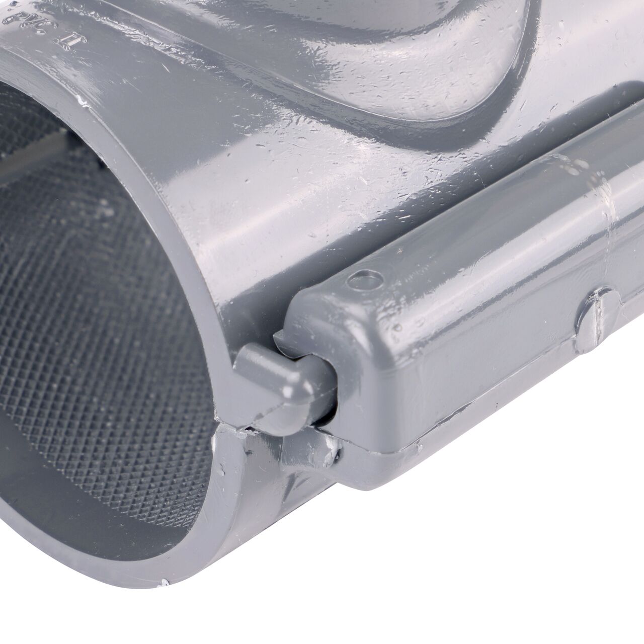 Closeup of the hinge closed on the NDS Clamp-It™ Rigid PVC Saddle with 1-1/2 in. slip connection on top (NDS 432515) for 2-1/2 in. PVC pipe