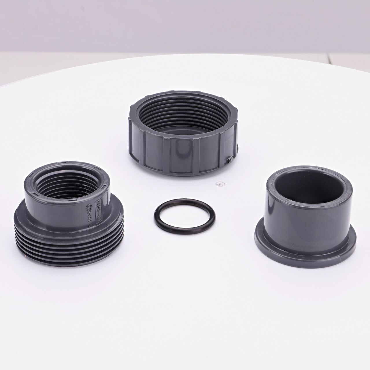 NDS PVC Union, 1 in. Sch. 80 S X FPT shown here unassembled includes the EPDM O-ring that is placed in the center of the union to create a leak-resistant seal (NDS U-1000-ST)
