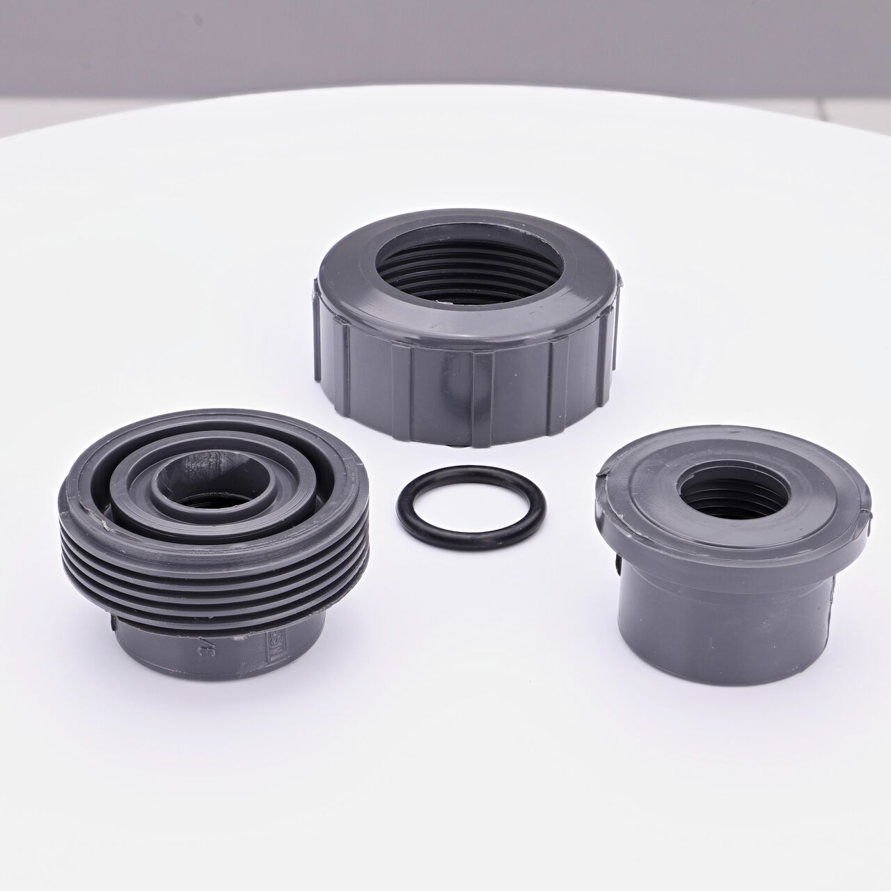 NDS PVC Union Ball Valve unassembled showing all the pieces including the Female threaded ends facing upwards that connect two 3/4 in. Sch. 80 pipes