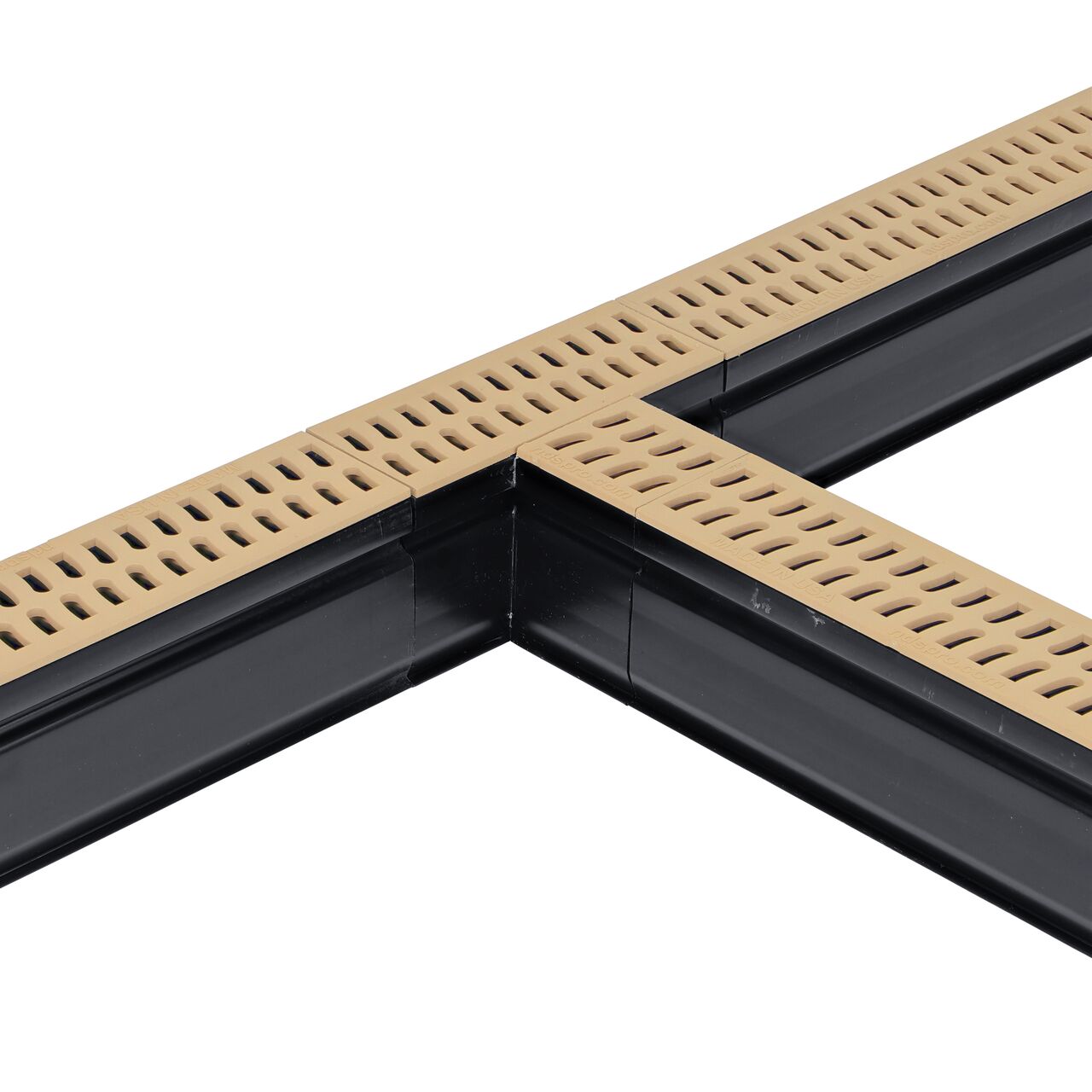 Installation shot with two channel drains and grates to the NDS Sand Slim Channel™ Drain Tee and Grate (NDS 9372)