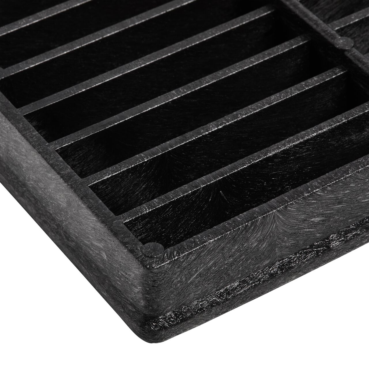 Closeup side view of the corner of the NDS 12 in. Square Sump Box Cover (NDS 1220) shows the depth of the cover