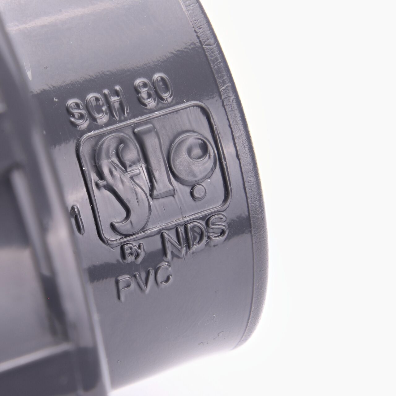 Closeup view of the size mark showing it is 1-1/2 in. IPS female connection point that makes a leak-resistant connection between pipes (NDS U-1000-ST)
