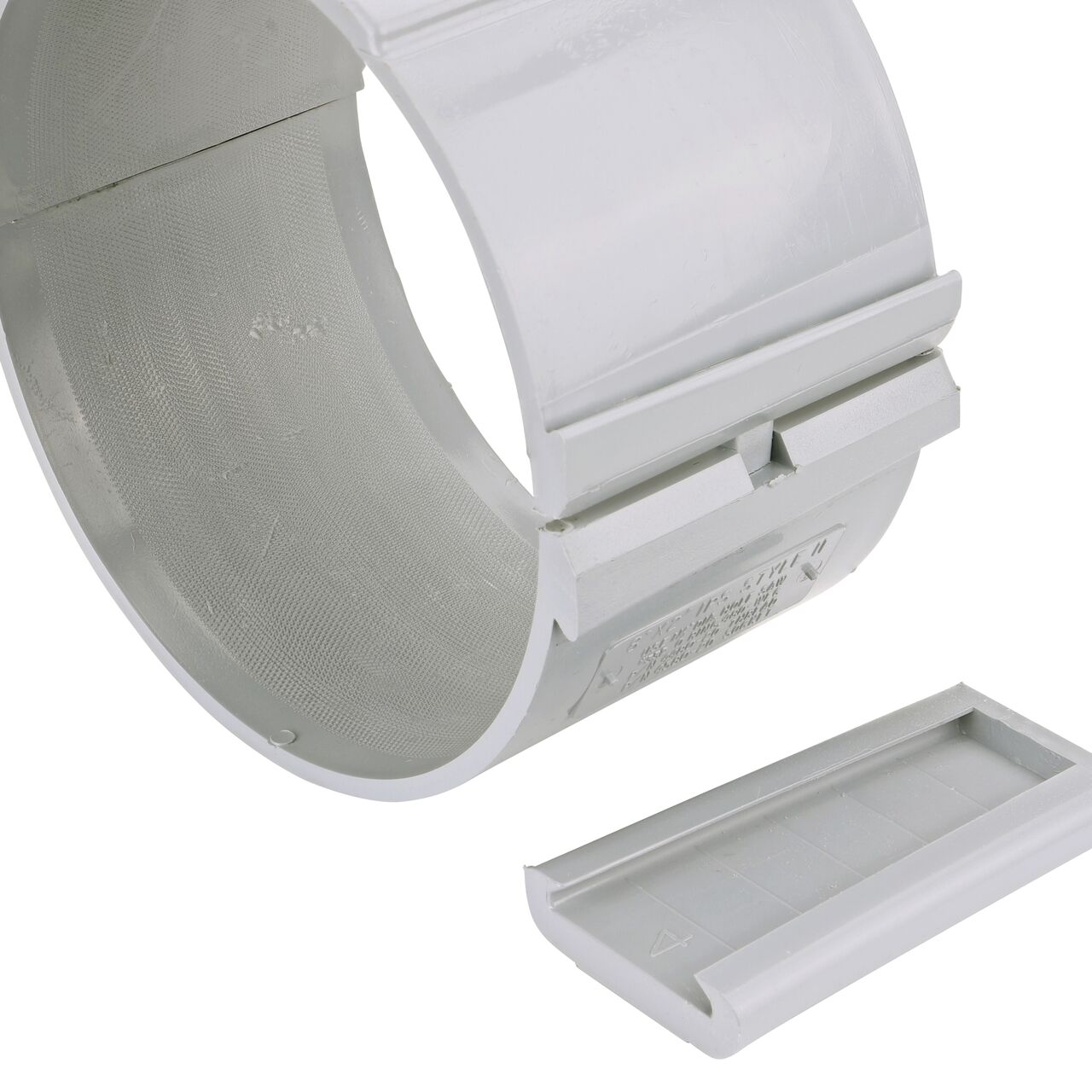 Closeup of the wedge latch uninstalled on the NDS Clamp-It™ Rigid PVC Saddle with 2 in. slip connection on top (NDS 458020) for 8 in. PVC pipe