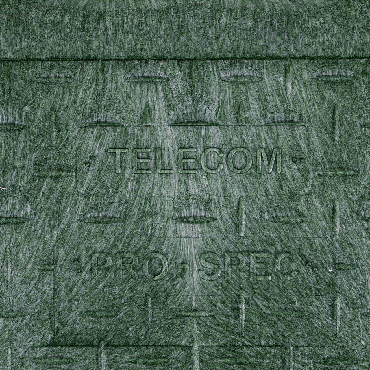 Closeup view of the Telecom markings on the green telecom cover for the NDS 14 in. X 19 in. Rectangular Pro-Spec Series Valve Box & Cover (NDS 326BCBT-BG)