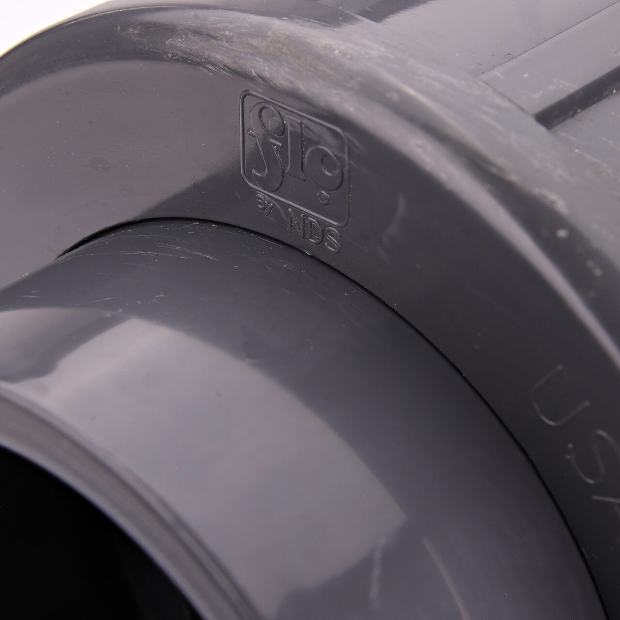 Closeup view of the NDS PVC Union shows each end is labeled that it connects to 2-1/2 in. Schedule 80 pipe for residential, commercial, and industrial applications (NDS U-2500-S)