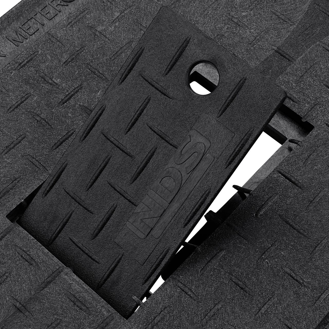 Close up view of the hinged side of the plastic reader door on the Water Meter Black Drop-in 13 in. X 20 in. Rectangular Standard Series Meter Cover which allows for easy meter reading (NDS D1500-DIRBL)
