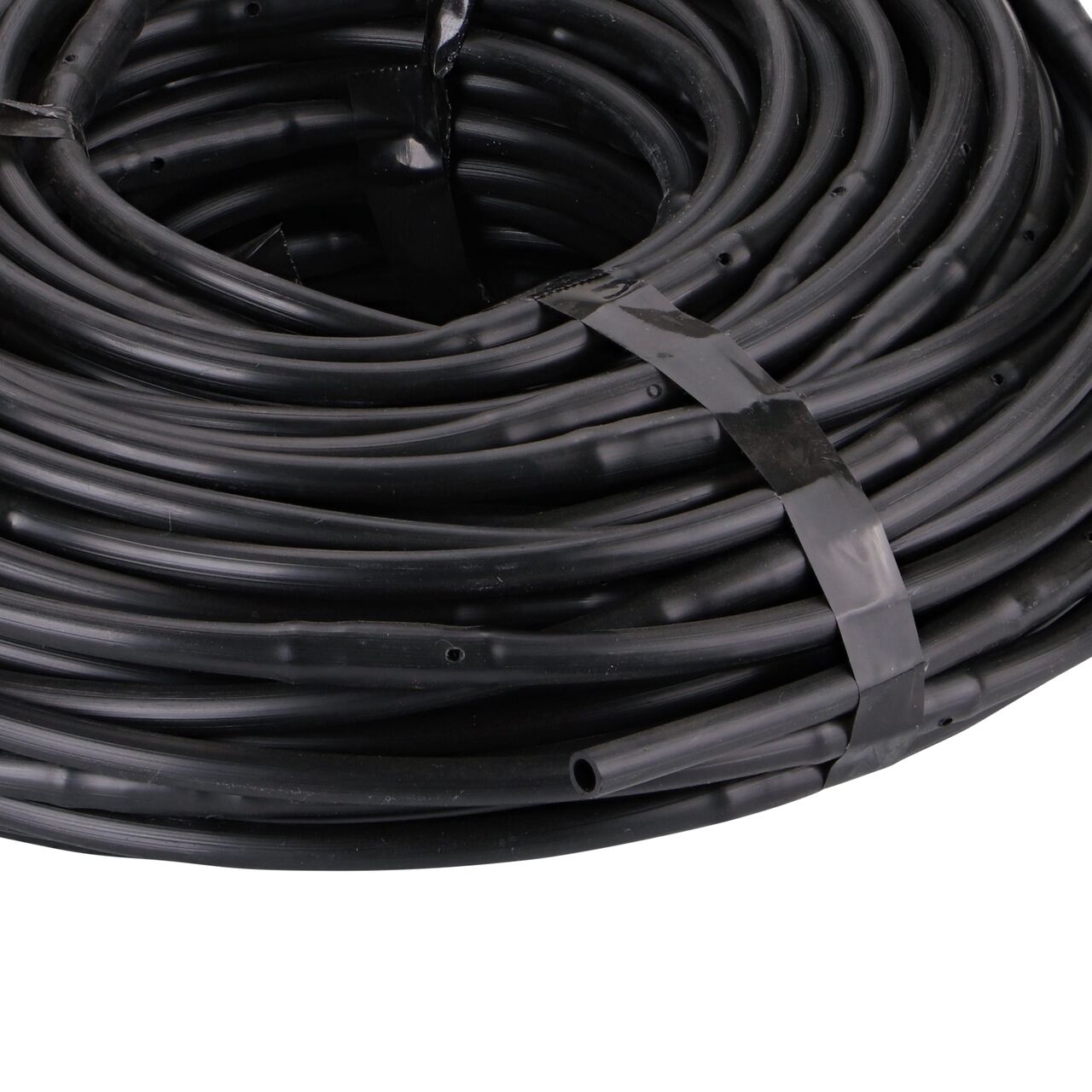 Closeup of the end of the NDS 100 ft. 1/4 in. Dura Flo™ JR Dripline with 6 in. spaced 0.5 GPH Non-Pressure Compensating Emitters (NDS SFJR-BL-06-01) without packaging tag on