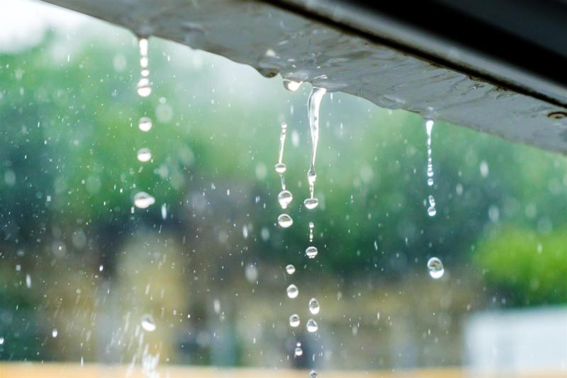 Rain Dropping Off Gutter