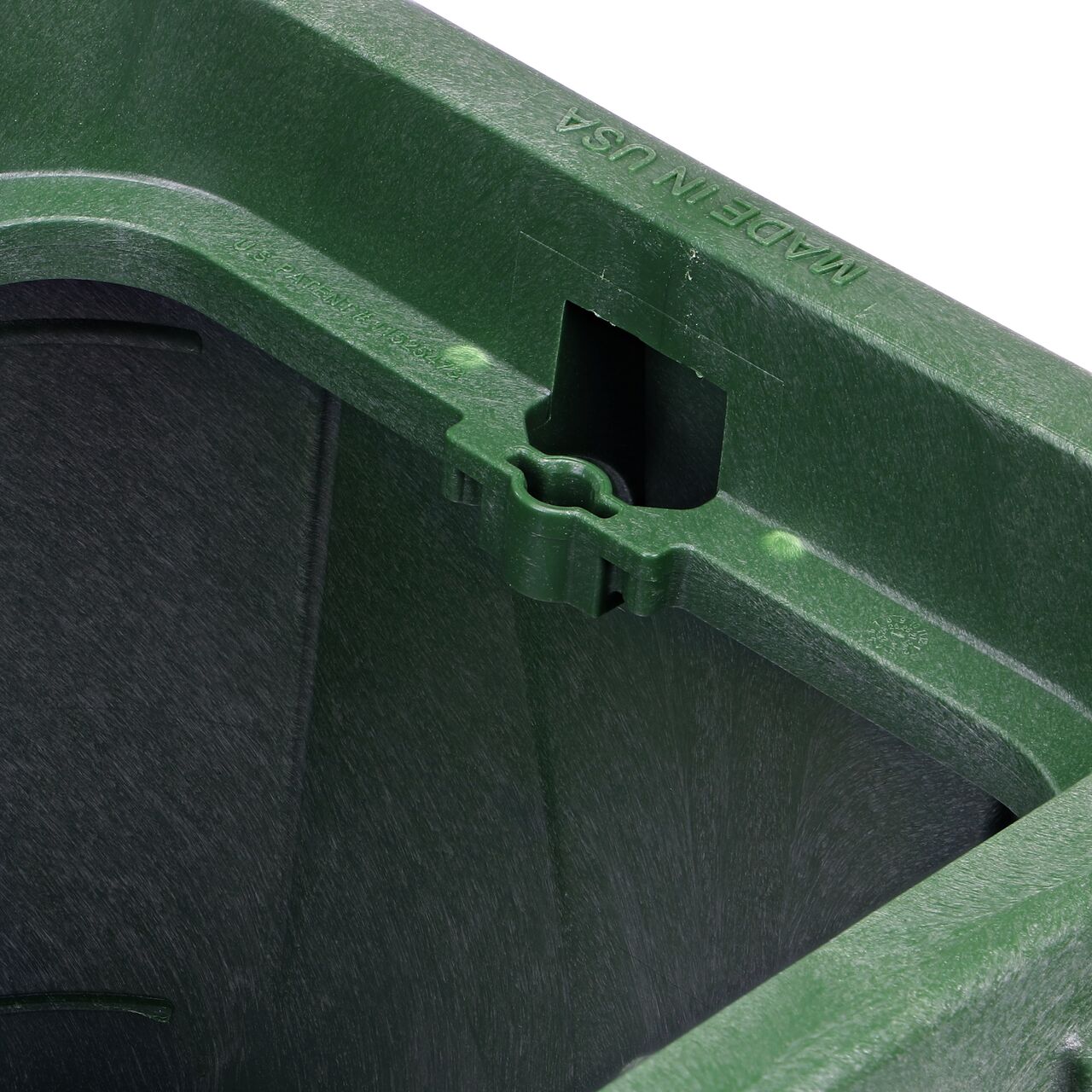 Closeup view of the universal locking mechanism hole on the Green NDS 14 X 19 in. Rectangular Pro-Spec® Series Valve Box (NDS 314BC) for securing valve lid or cover to the valve box