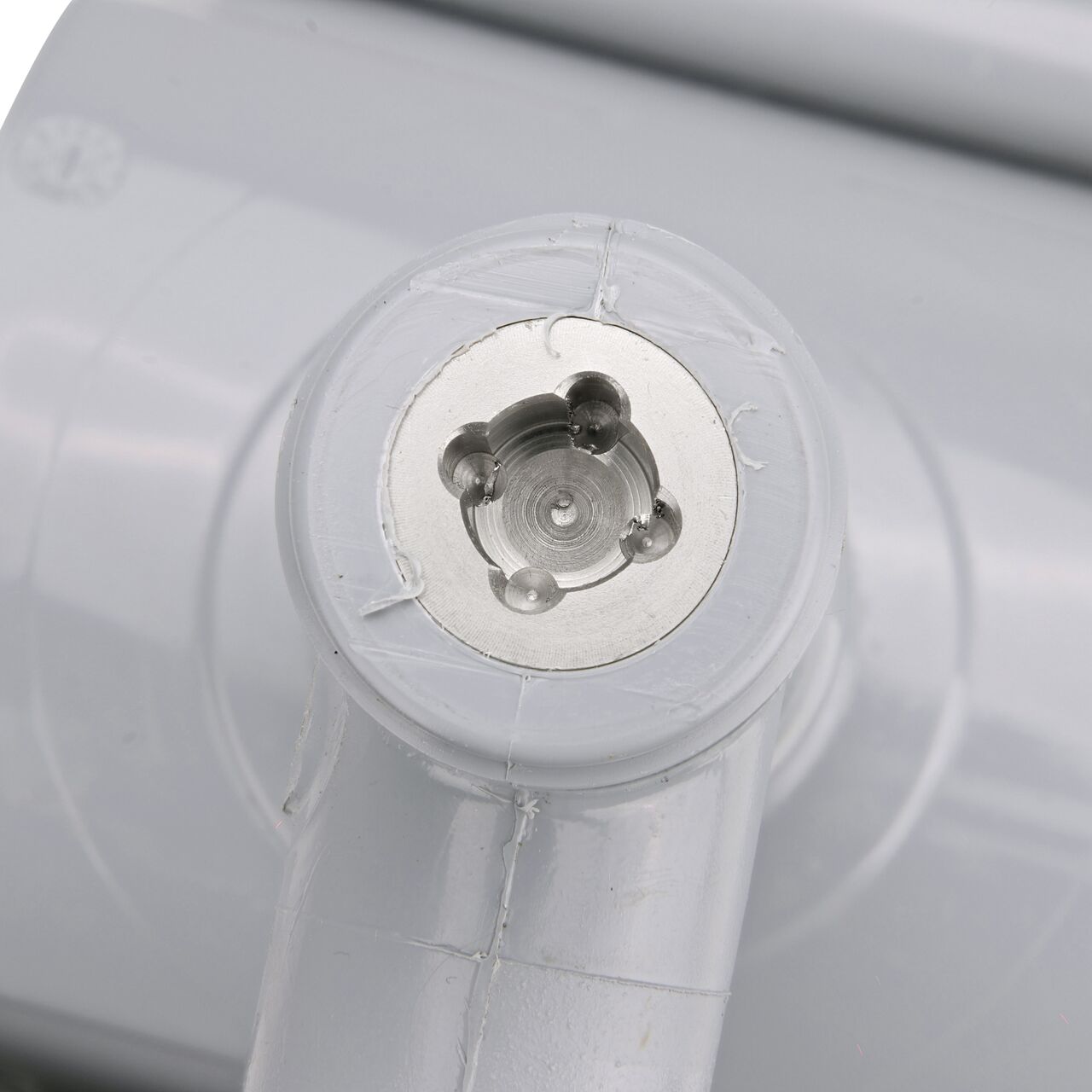 Closeup view of the built-in saw tooth cutter in the top connection of the 4 in. NDS Flo-Tap™ Rigid PVC saddle with 3/4 in. socket or 1 in. spigot which cuts easily through PVC pipe wall and captures debris before it can enter the water supply (NDS 3140)