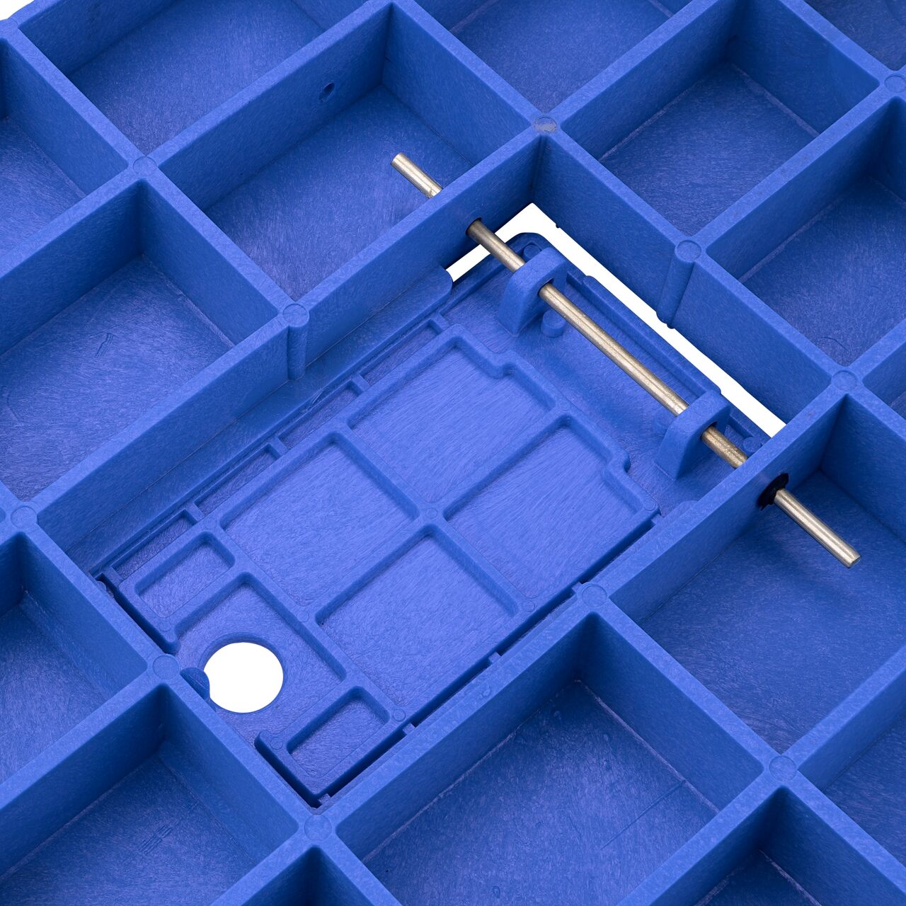 Close up view of the underside on the Blue Water Meter Drop-in 13 in. X 20 in. Rectangular Standard Series Meter Cover showing the hinge of the Plastic reader door on the (NDS D1500-DIRBLU)