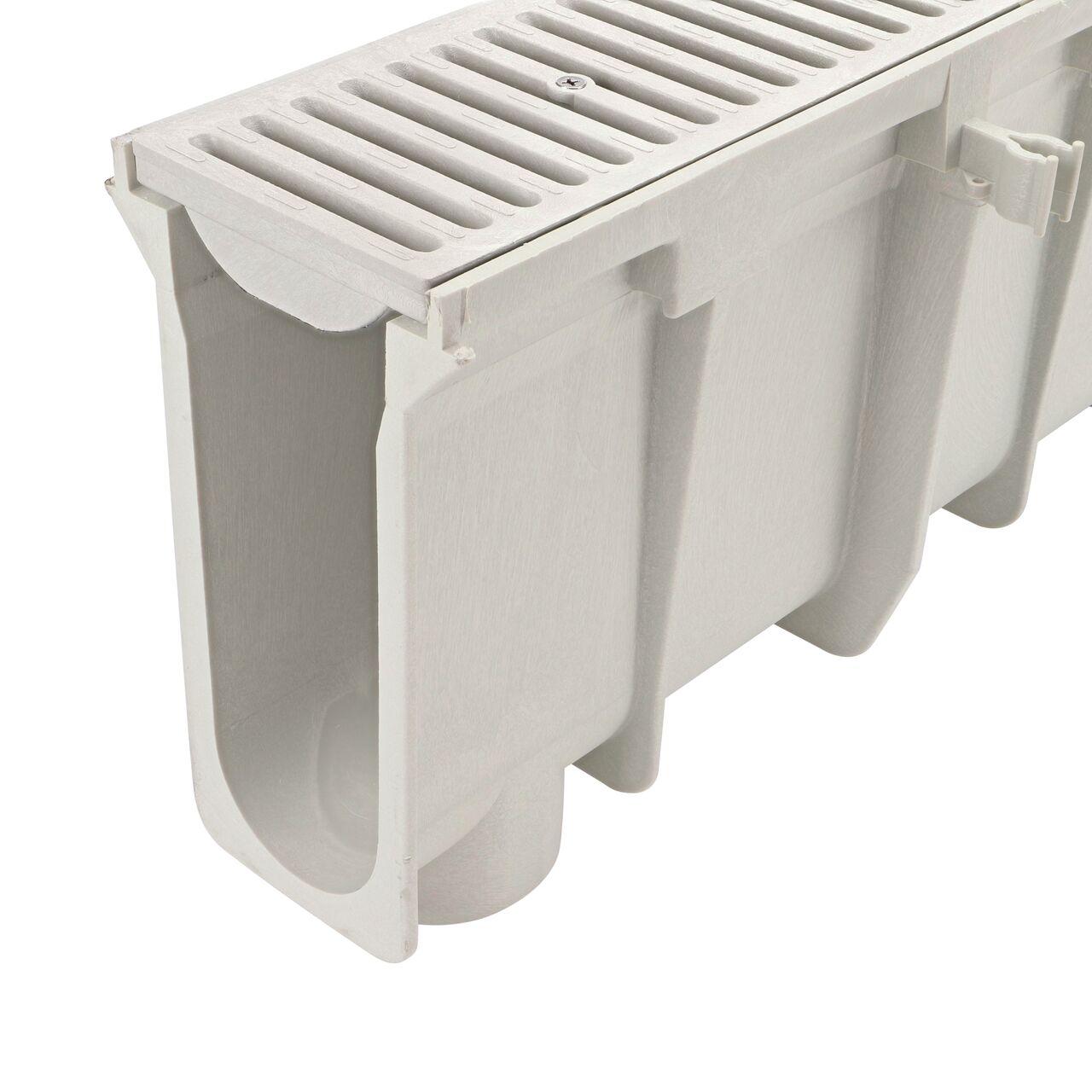 Closeup tongue (male) side of the NDS 11.39 in. Deep Neutral Dura Slope Channel Drain (NDS DS-112N) with the Standard Dura Slope Light Gray Grate installed (NDS 661LG)