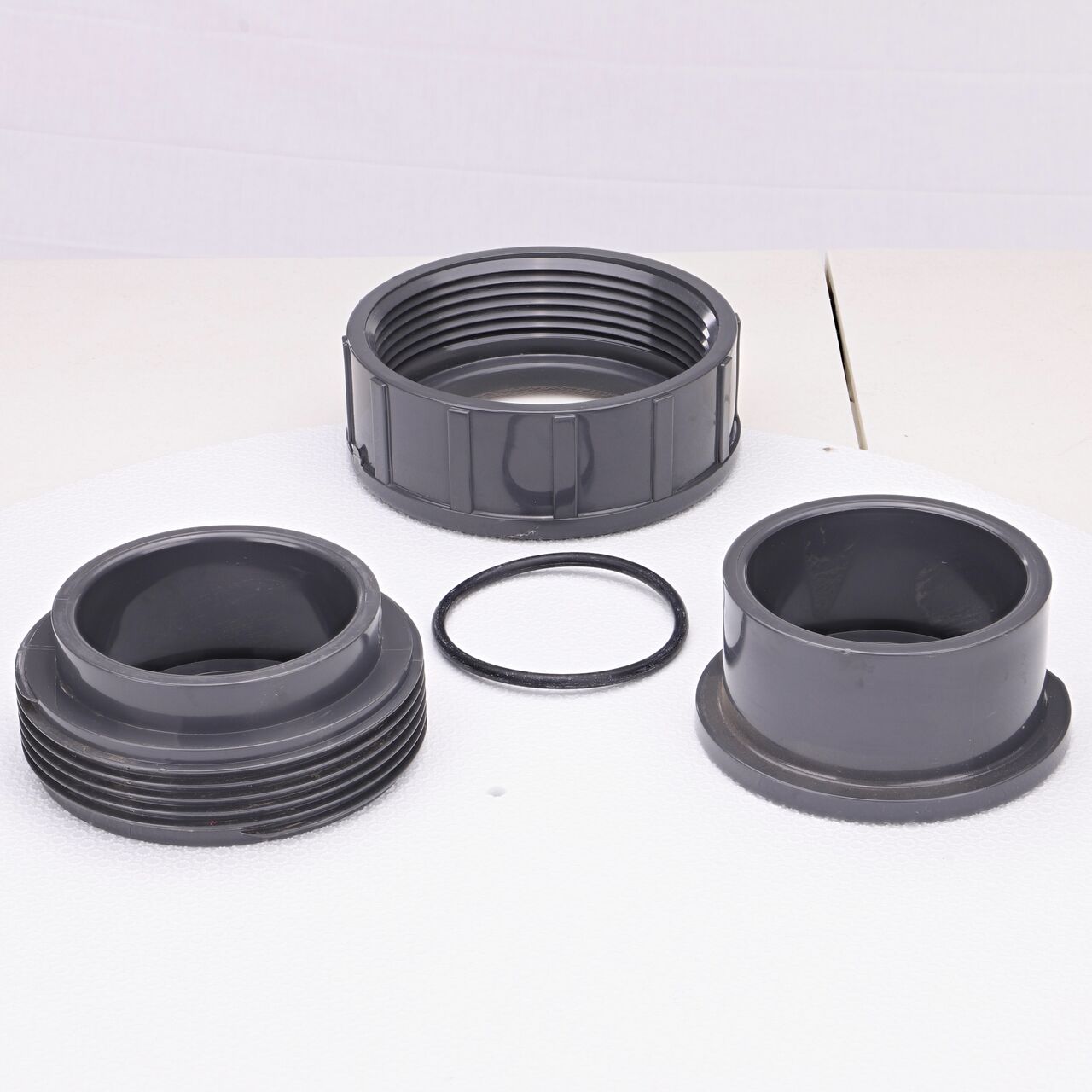 The NDS 3 in. PVC Union shown here unassembled, includes the EPDM O-ring that is placed in the center of the union to create a leak-resistant seal (NDS U-3000-S)