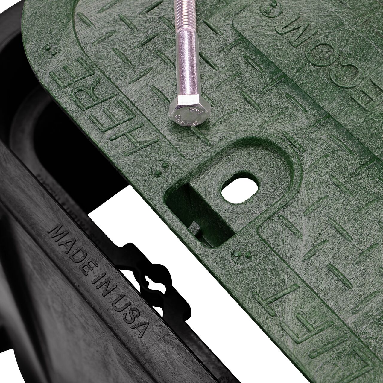 Align the bolt hole on the lid with the bolt hole from the box on the NDS 14 in. X 19 in. Rectangular Pro-Spec Series Black Box and Green Telecom Bolt-down Cover (NDS 313BCBT) for a secure fit