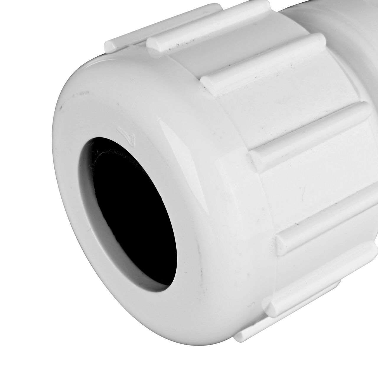 Closeup view of the NDS IPS UC Compression Coupling showing the 1/2 in. compression end with adjustable nut secured which reduces pull-out from pipe (NDS CPC-0500)
