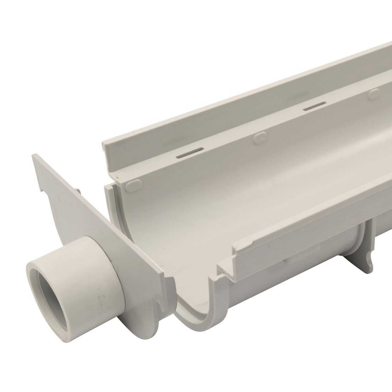 NDS 5 in. Pro Series Channel Drain, End Cap/End Outlet (NDS 821) just before being installed on the Shallow Profile Channel Drain (NDS 800) only