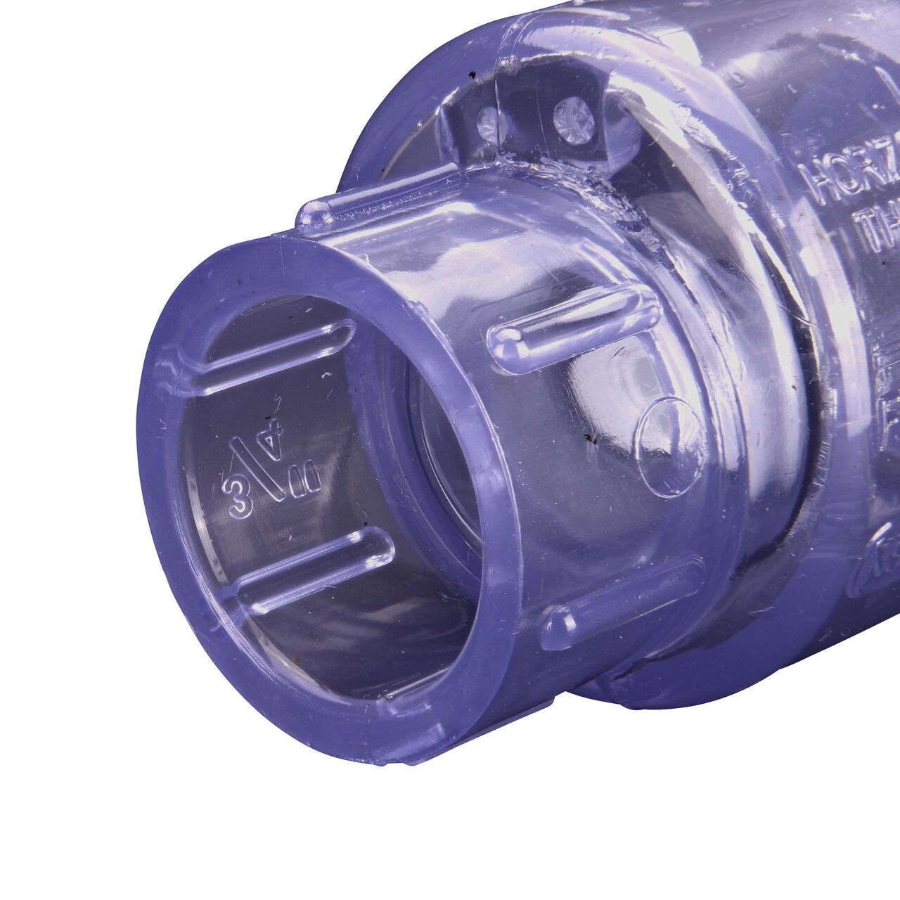 Closeup of the outlet end of the NDS Clear 3/4 in. slip end by slip end PVC Swing Check Valve (NDS 1520C07) which prevents backflow in pipelines