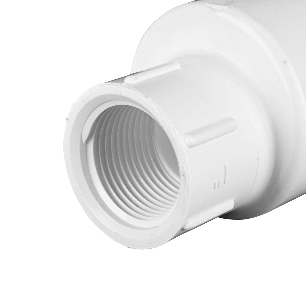 Closeup of the outlet end of the NDS White 1 in. female end by female end PVC Swing Check Valve (NDS 1520-10F) which prevents backflow in pipelines