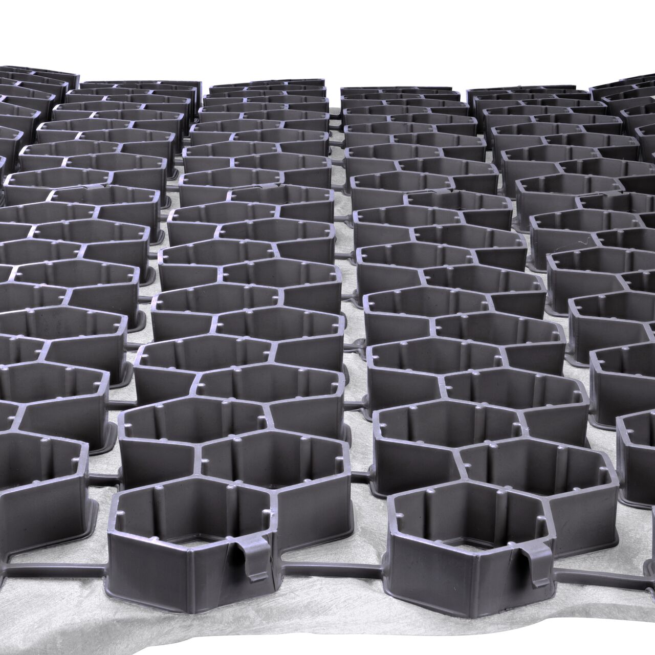 Secure two Gray NDS EZ Roll® Gravel Paver (NDS GP4X150G) rolls together side by side with the top-down locking tabs for a quicker, easier installation; no tools required