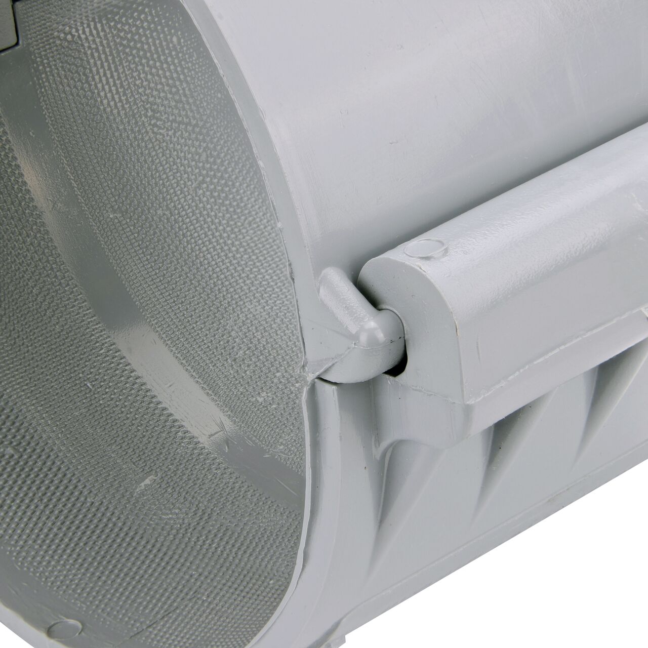 Closeup of the hinge closed on the NDS Clamp-It™ Rigid PVC Saddle with 2 in. FPT connection on top (NDS 446020) for 6 in. PVC pipe