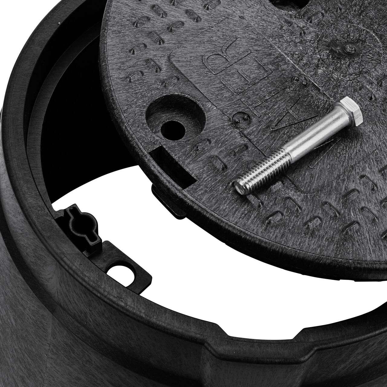 Align the bolt hole on the lid with the bolt hole from the NDS 10 in. Round Standard Series Black Box and Black Water Cover (NDS 111BCBW) for a secure fit