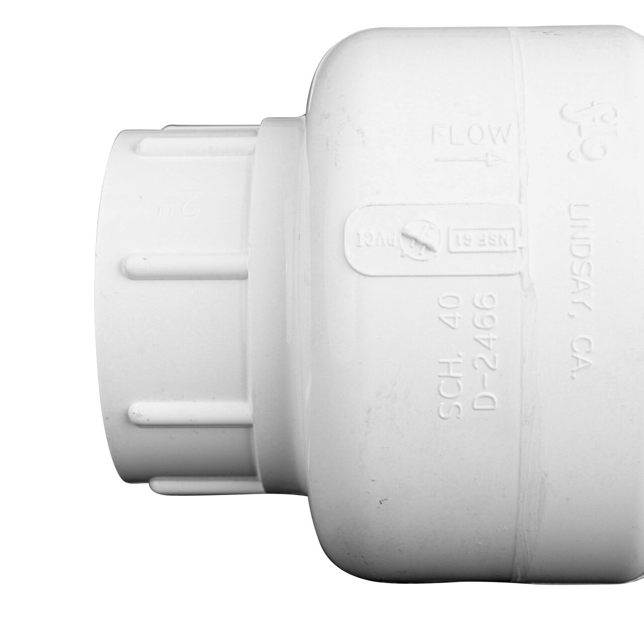 Closeup of the arrow showing water flow direction on the NDS White 2 in. slip end by slip end PVC Swing Check Valve (NDS 1520-20)